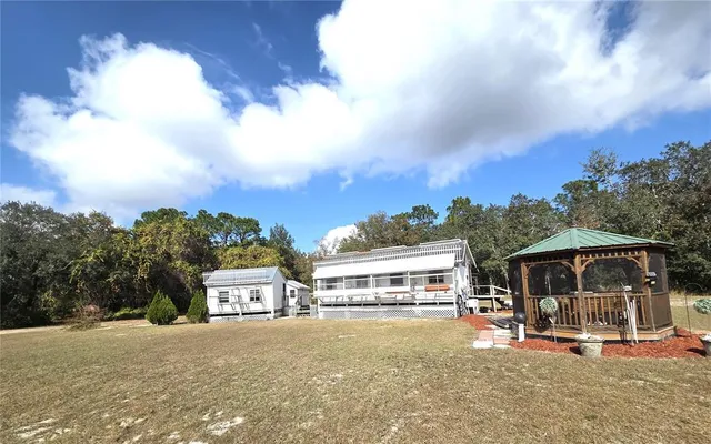 a view of a patio with a table and chairs