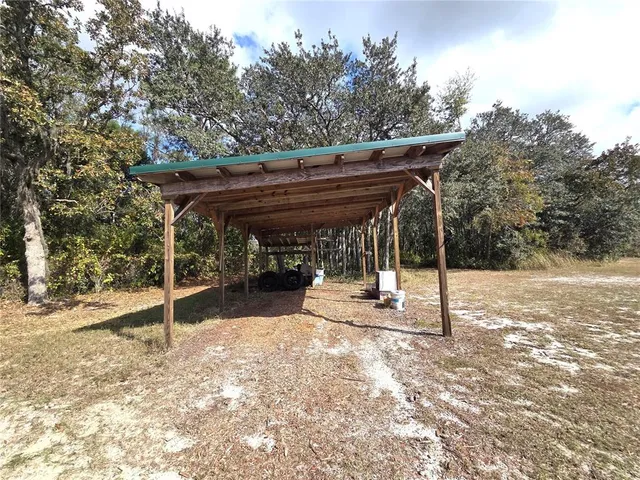 a view of a big room with an outdoor space and seating
