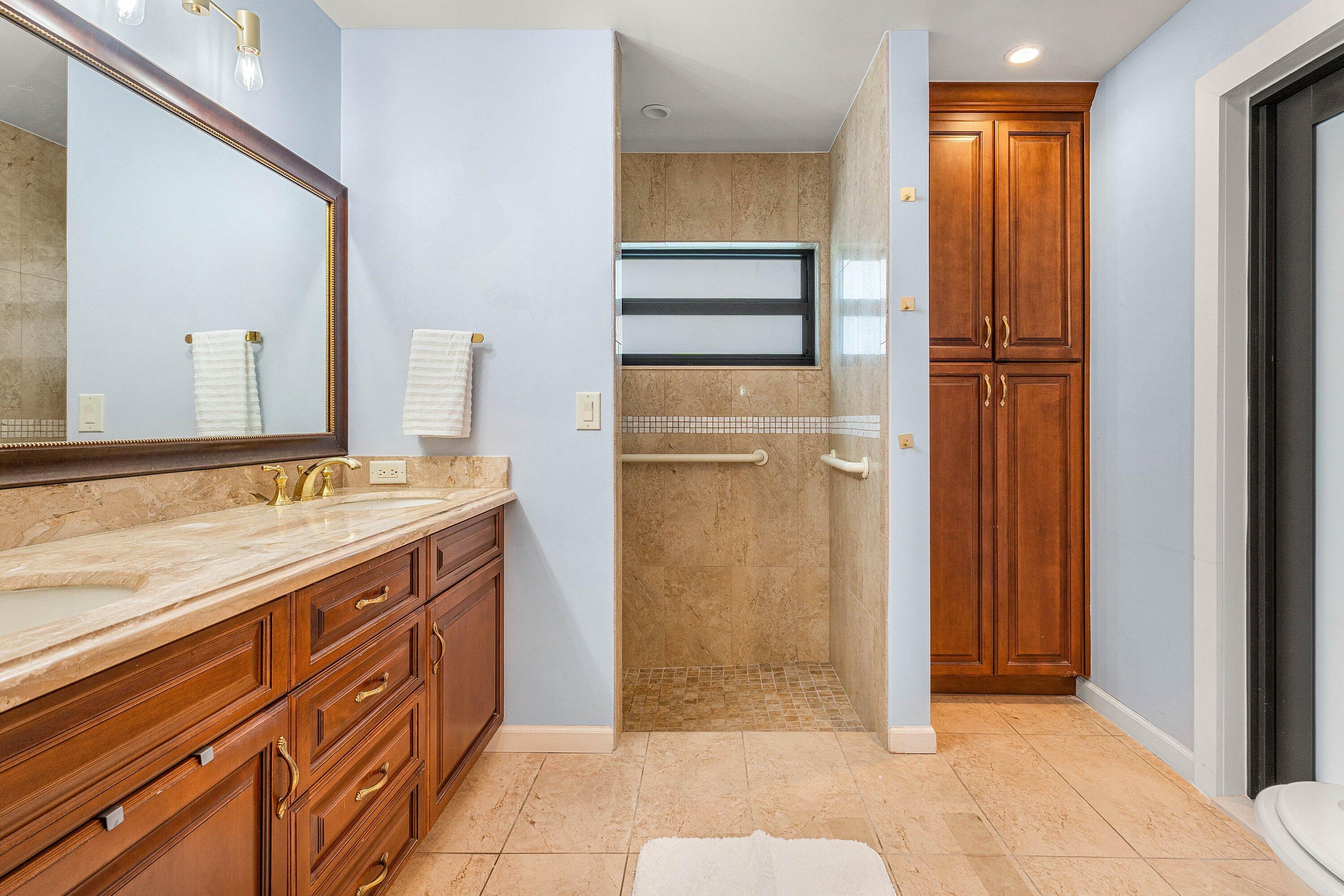 10174 Crosswind Road Boca Raton, FL 33498 - Photo 20 of 45 a bathroom with a granite countertop sink and a mirror