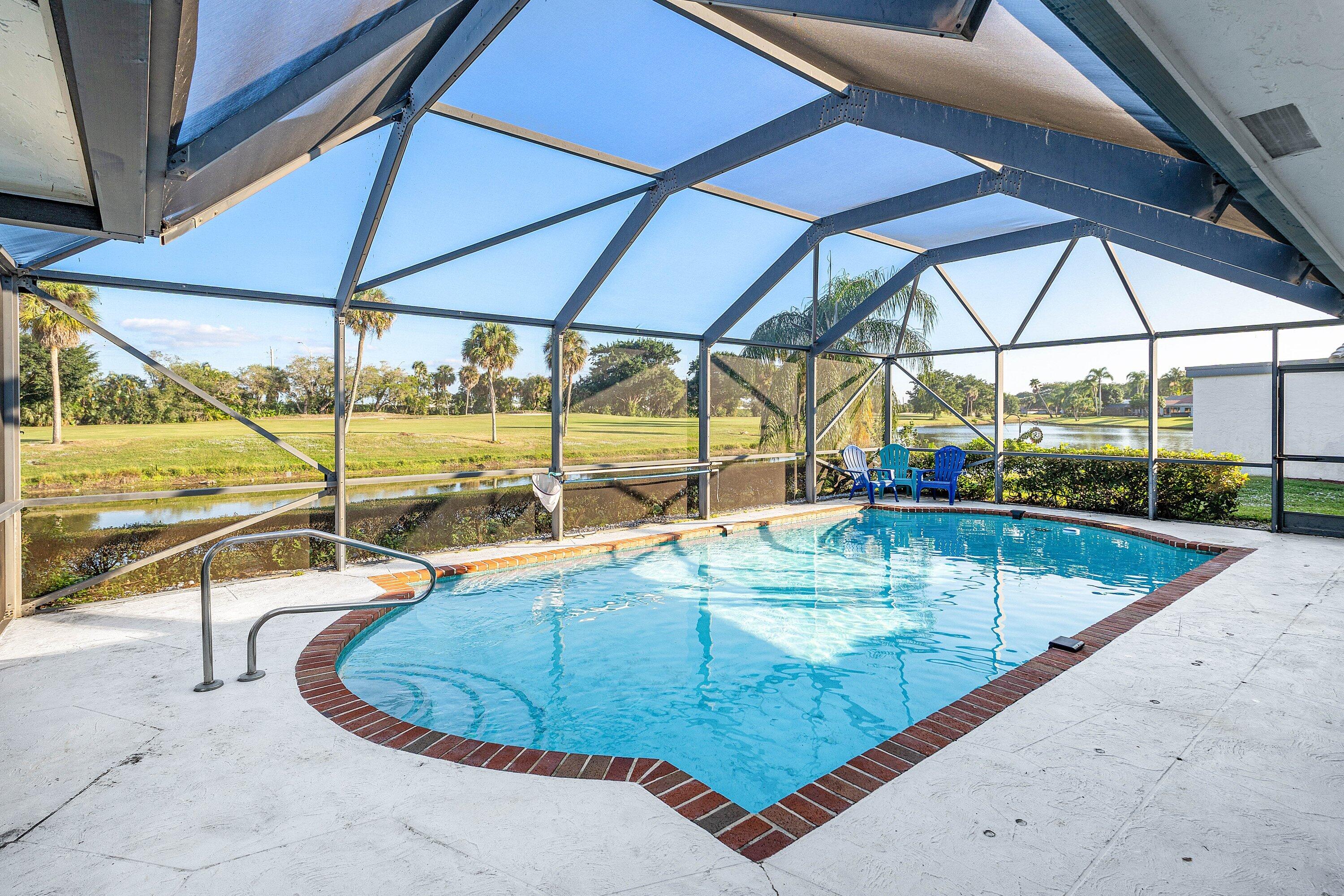 10174 Crosswind Road Boca Raton, FL 33498 - Photo 26 of 45 an outdoor view with a swimming pool