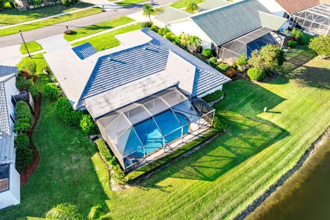 a view of a backyard with plants and a swimming pool