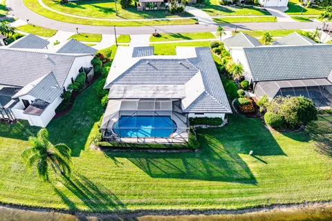 a aerial view of a house with a yard