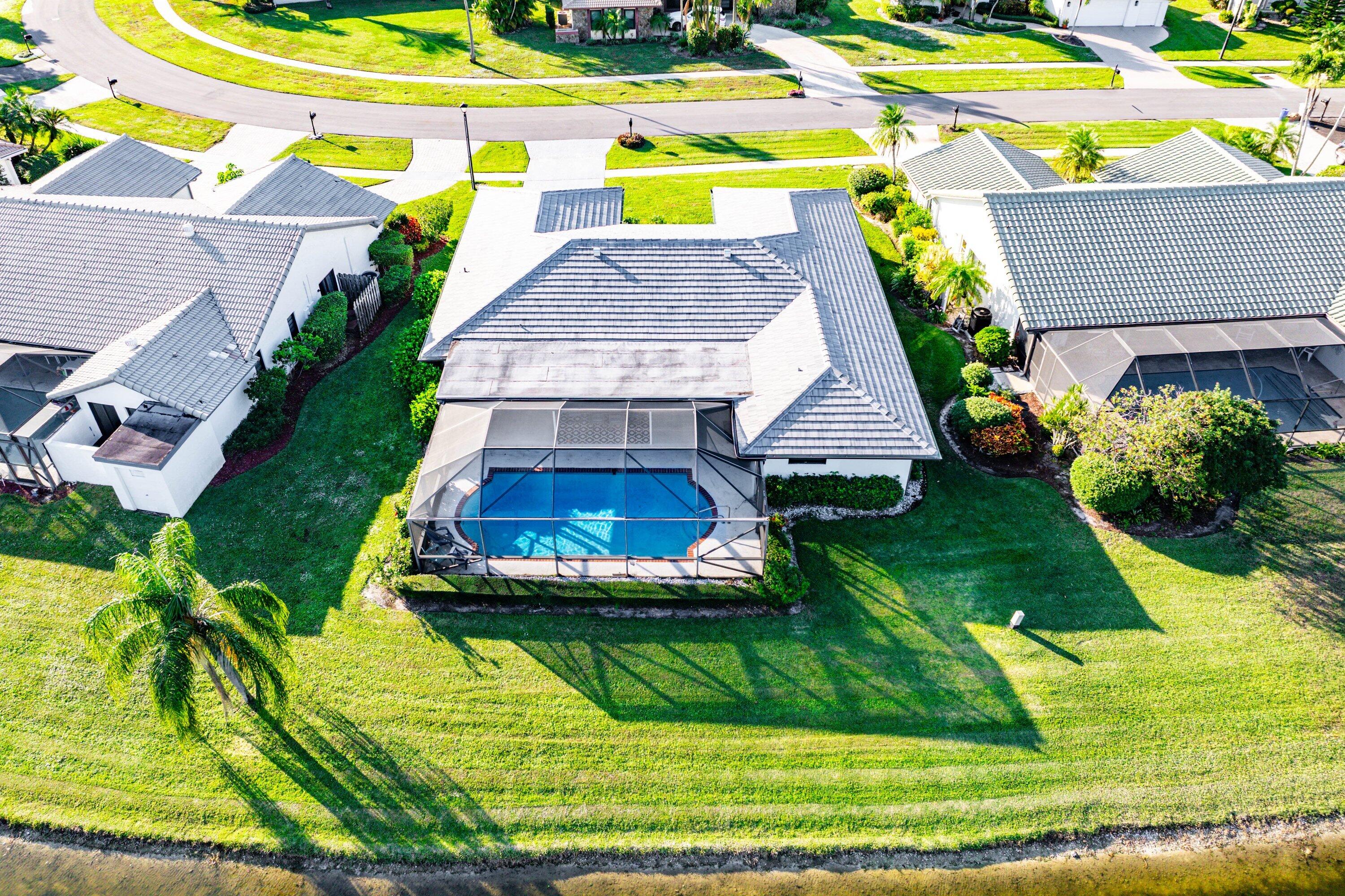 10174 Crosswind Road Boca Raton, FL 33498 - Photo 36 of 45 a aerial view of a house with a yard