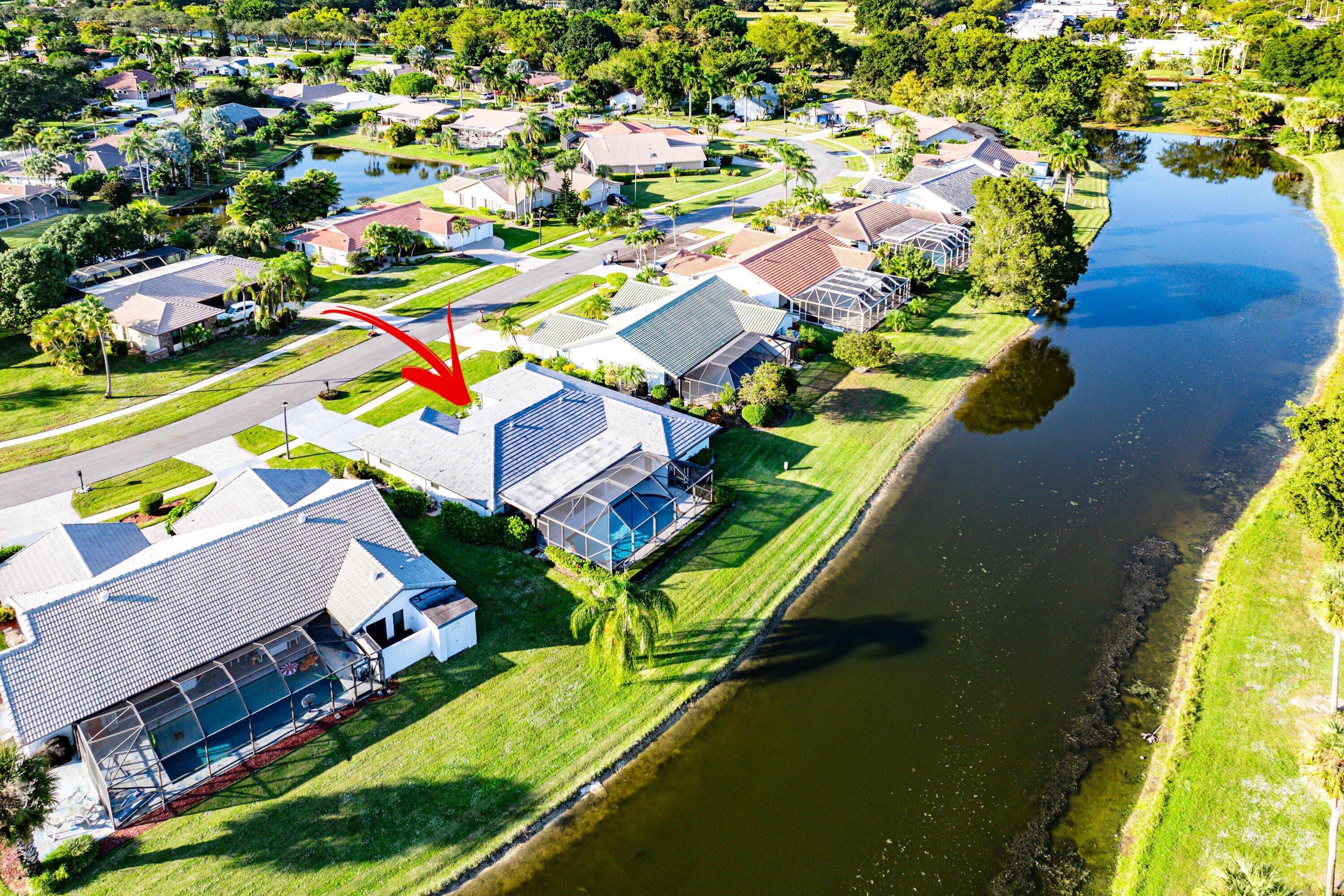 10174 Crosswind Road Boca Raton, FL 33498 - Photo 43 of 45 an aerial view of a house with a garden and swimming pool