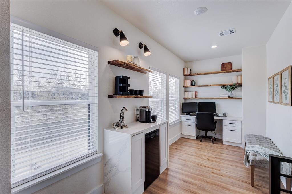 3230 6th Avenue Fort Worth, TX 76110 - Photo 24 of 37 a view of a kitchen with cabinets and wooden floor