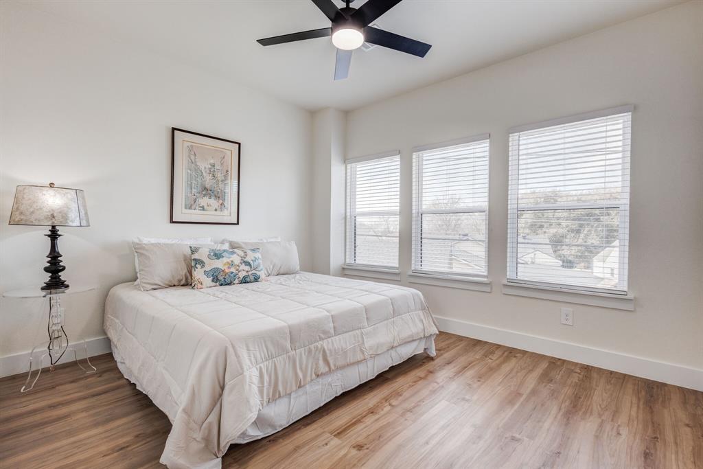 3230 6th Avenue Fort Worth, TX 76110 - Photo 27 of 37 a bedroom with a bed and a window