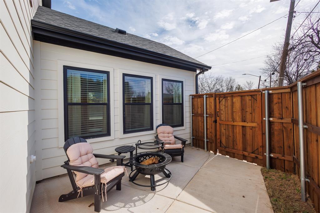 3230 6th Avenue Fort Worth, TX 76110 - Photo 34 of 37 a backyard of a house with outdoor seating