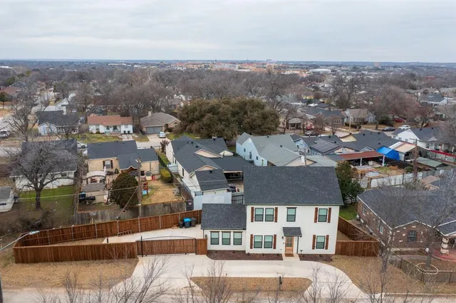 an aerial view of residential houses and city view