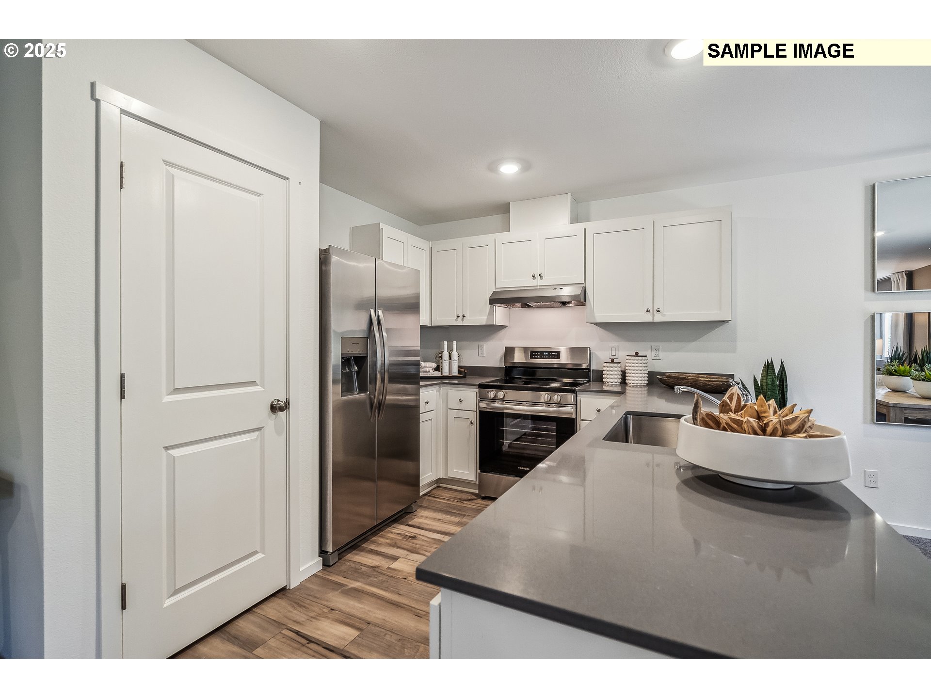 5791 Durst Street Eugene, OR 97402 - Photo 2 of 25 a kitchen with refrigerator and cabinets