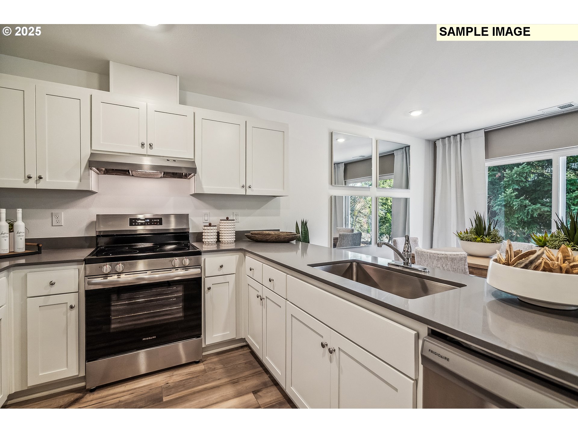 5791 Durst Street Eugene, OR 97402 - Photo 3 of 25 a kitchen with a sink stove and cabinets