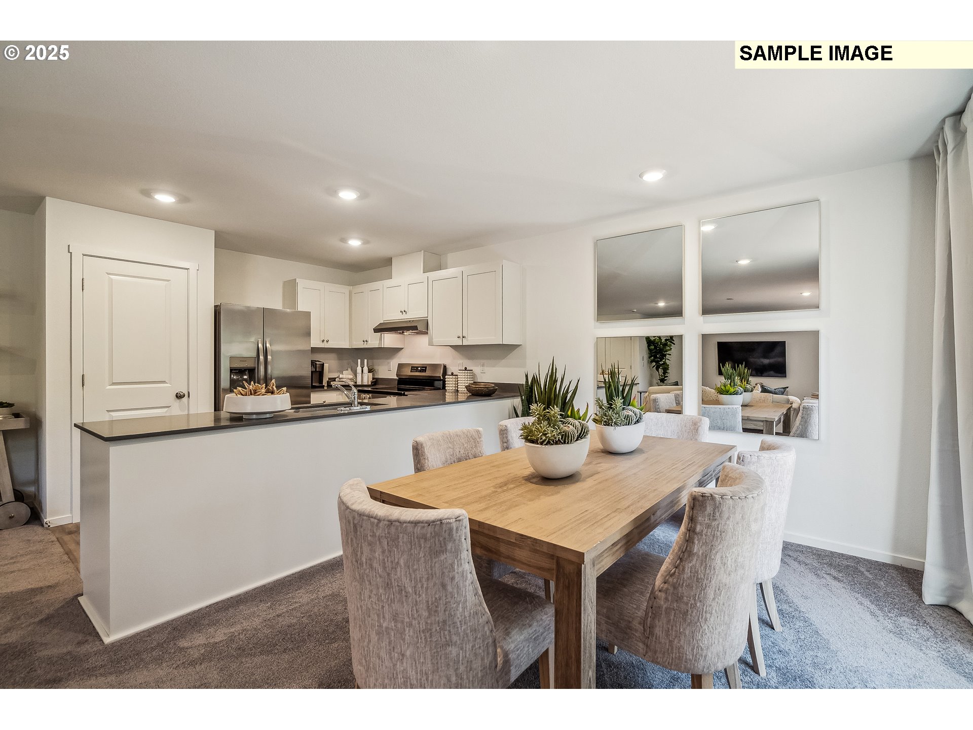 5791 Durst Street Eugene, OR 97402 - Photo 4 of 25 a kitchen with a dining table chairs refrigerator stove and cabinets