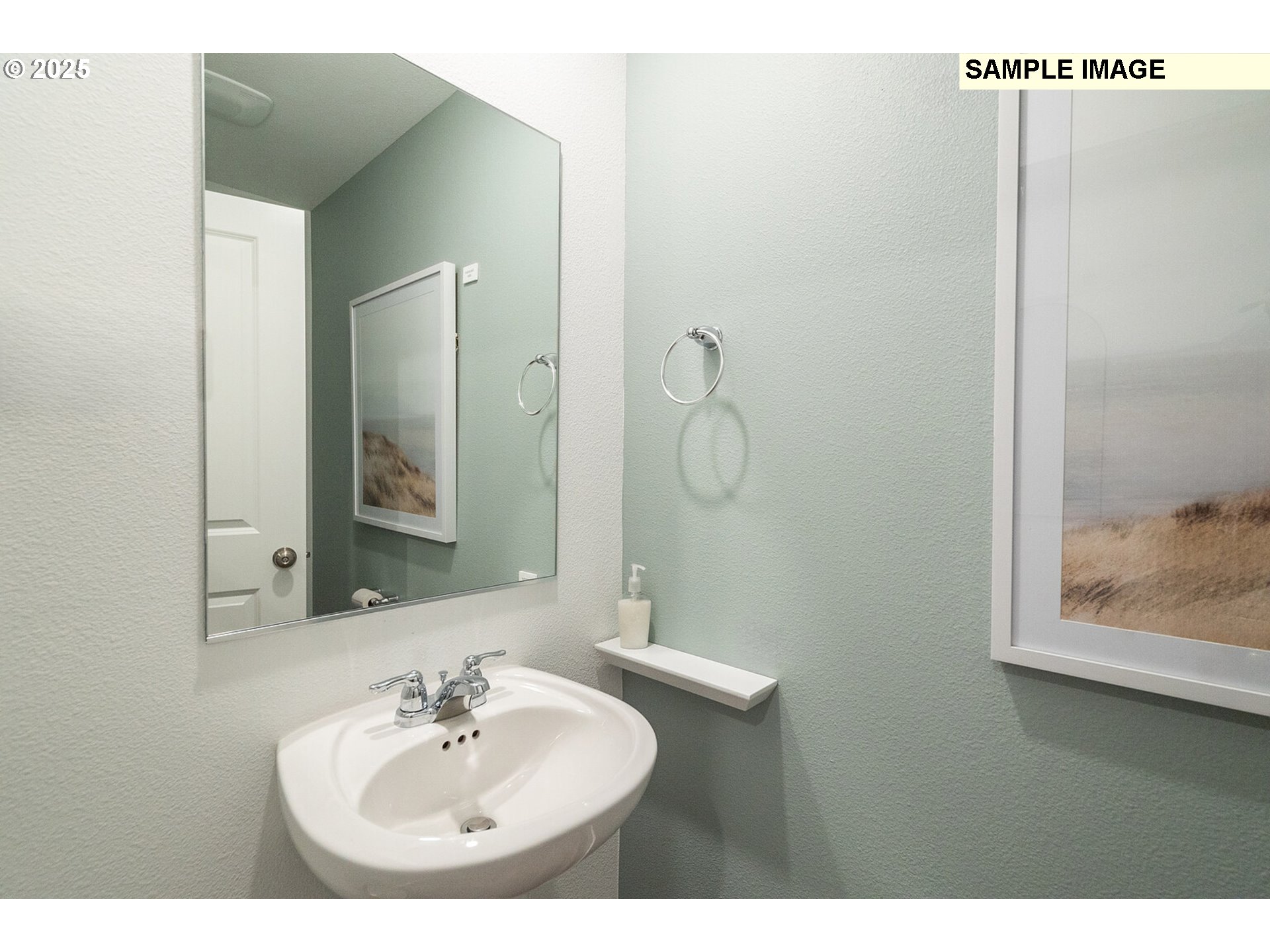 5791 Durst Street Eugene, OR 97402 - Photo 10 of 25 a bathroom with a sink and a mirror