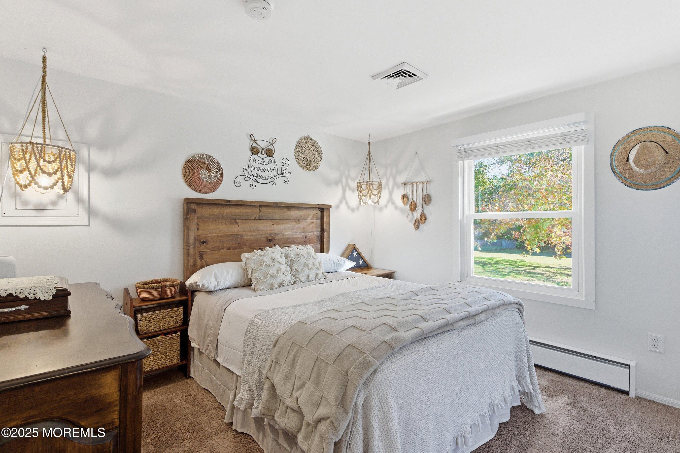 145 Cassville Road Jackson, NJ 08527 - Photo 21 of 35 a bedroom with a bed and a window