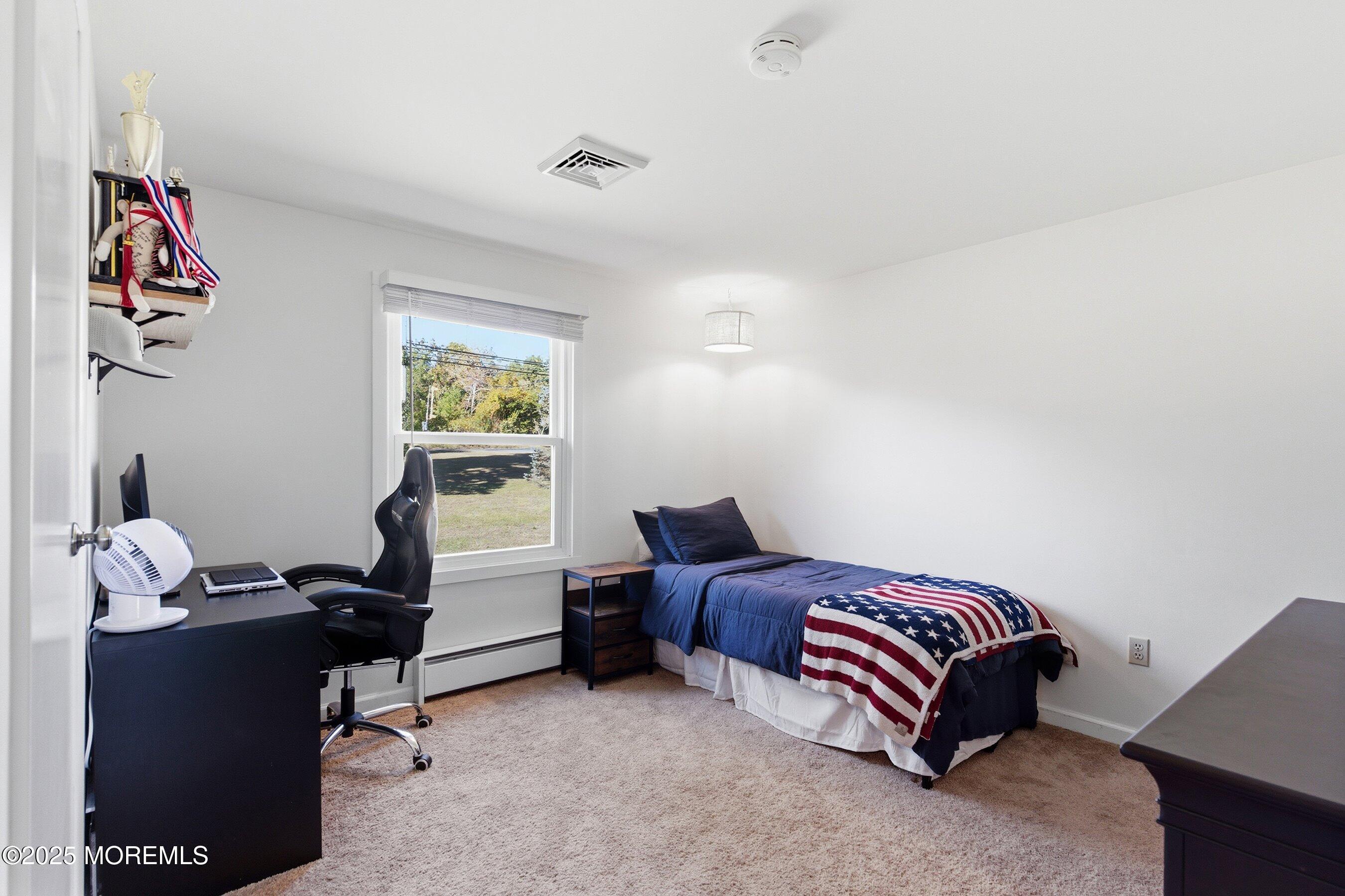 145 Cassville Road Jackson, NJ 08527 - Photo 24 of 35 a bedroom with a bed and a window