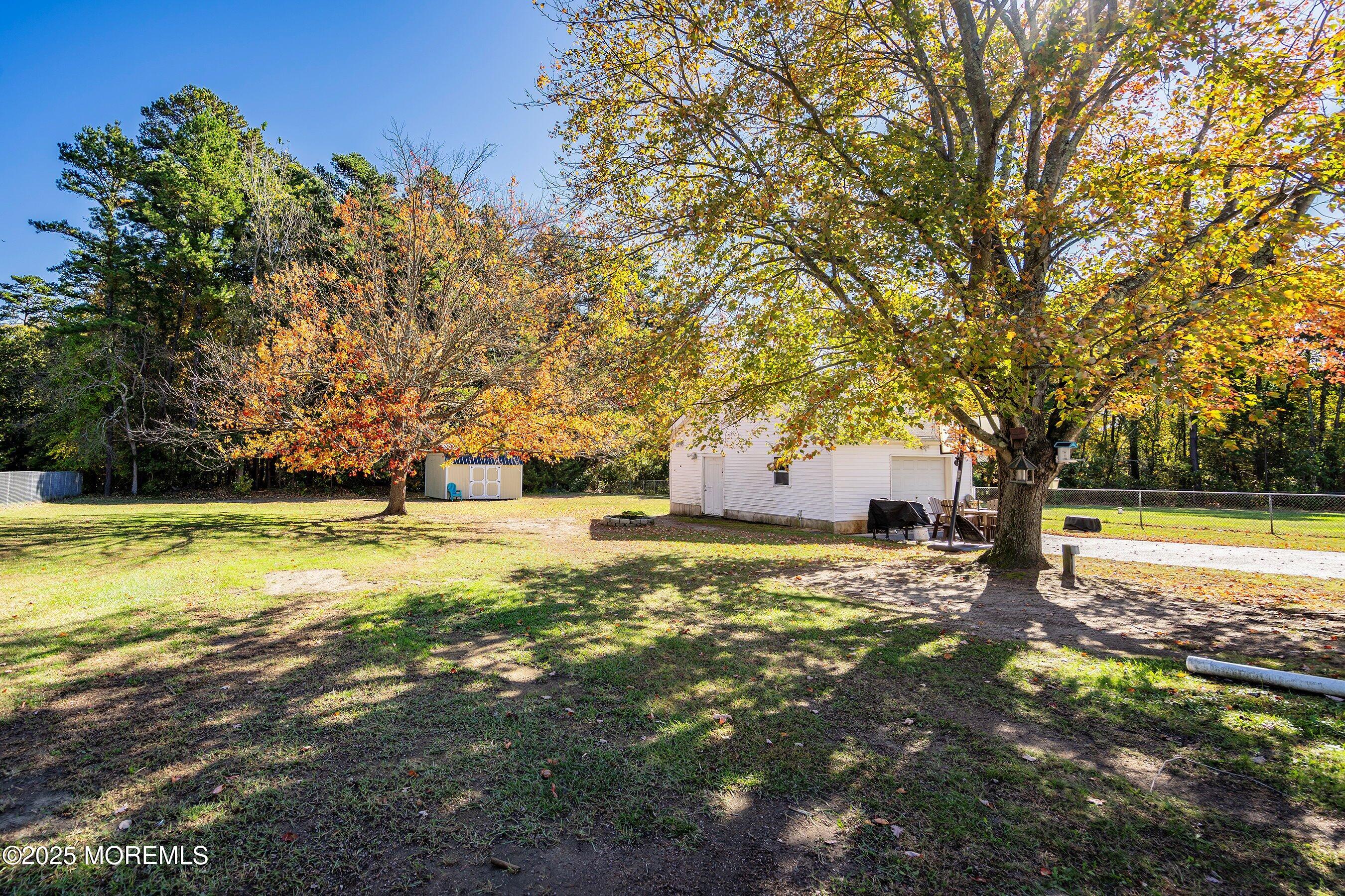 145 Cassville Road Jackson, NJ 08527 - Photo 28 of 35 a swimming pool with trees in the background