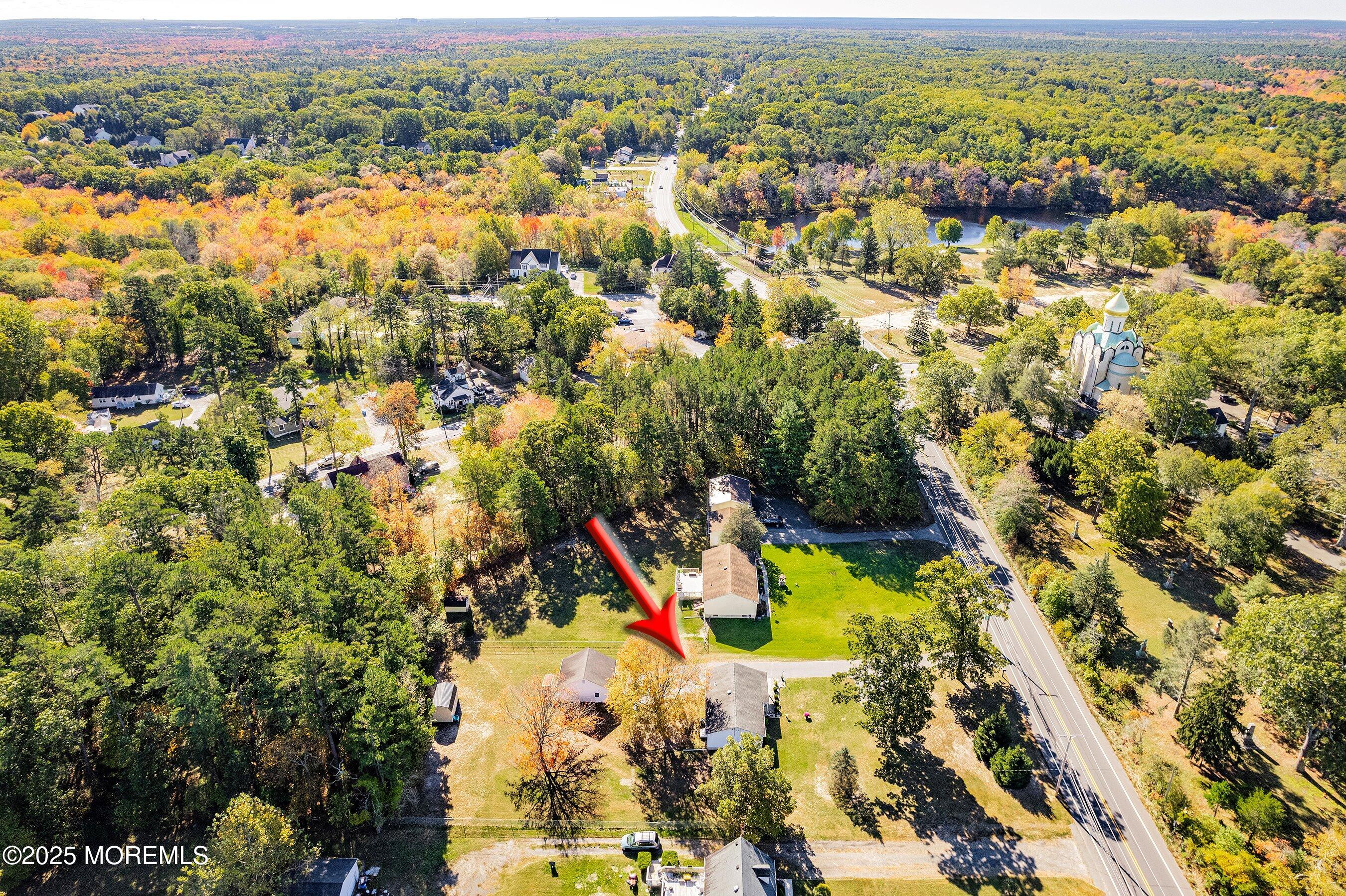 145 Cassville Road Jackson, NJ 08527 - Photo 32 of 35 an aerial view of residential houses with outdoor space and trees