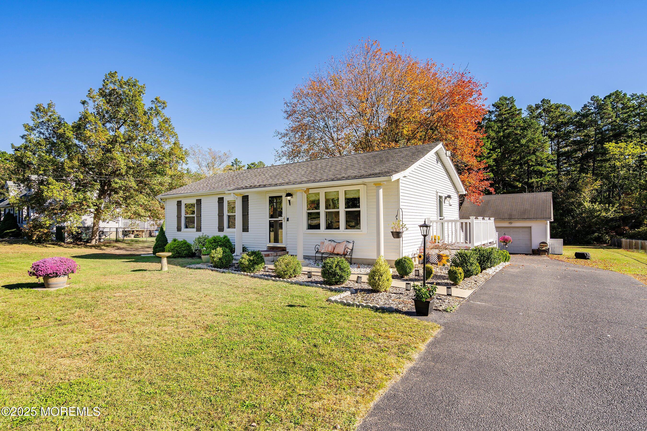 145 Cassville Road Jackson, NJ 08527 - Photo 6 of 35 a front view of house with yard seating and green space