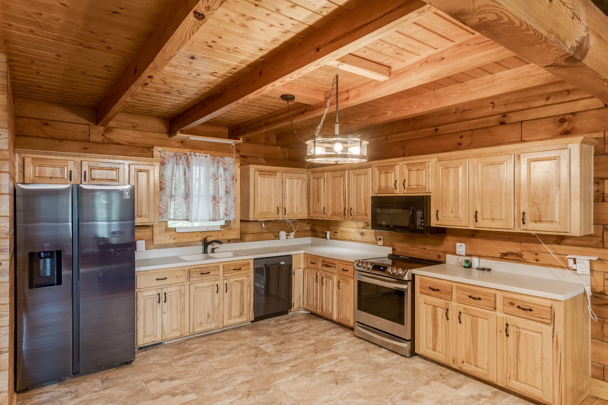 3585 Cooper Nicholson Road Pleasant View, TN 37146 - Photo 13 of 41 a kitchen with stainless steel appliances a stove sink and refrigerator