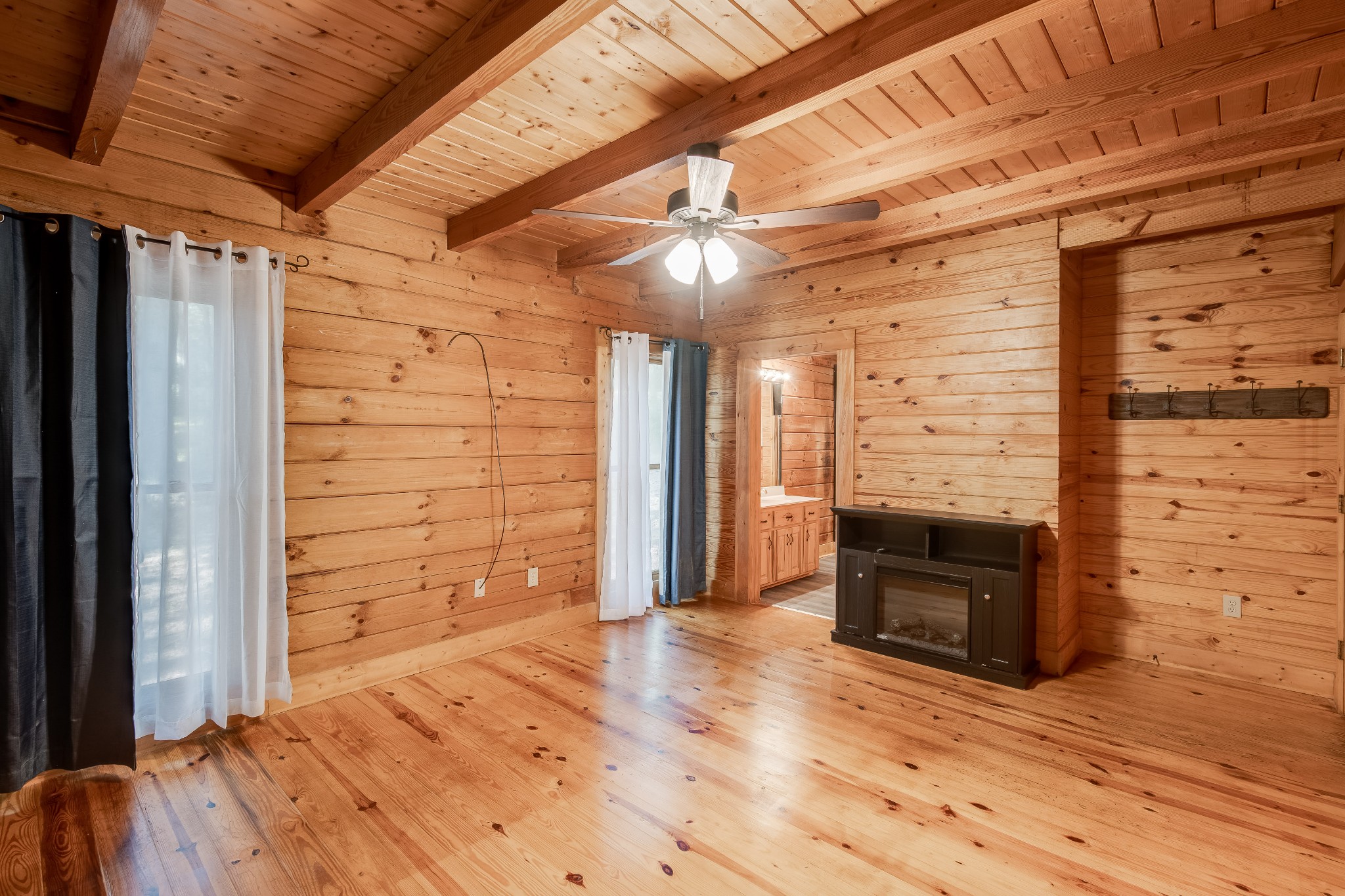 3585 Cooper Nicholson Road Pleasant View, TN 37146 - Photo 18 of 41 a view of empty room with wooden floor and fireplace