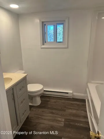 a bathroom with a toilet and a sink