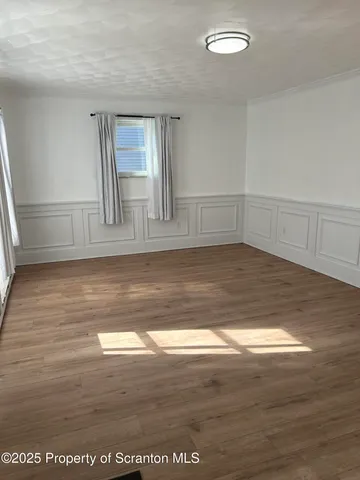 a view of lot of kitchen and wooden floor