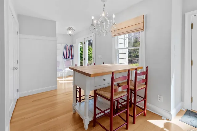 a view of a dining room with furniture and window