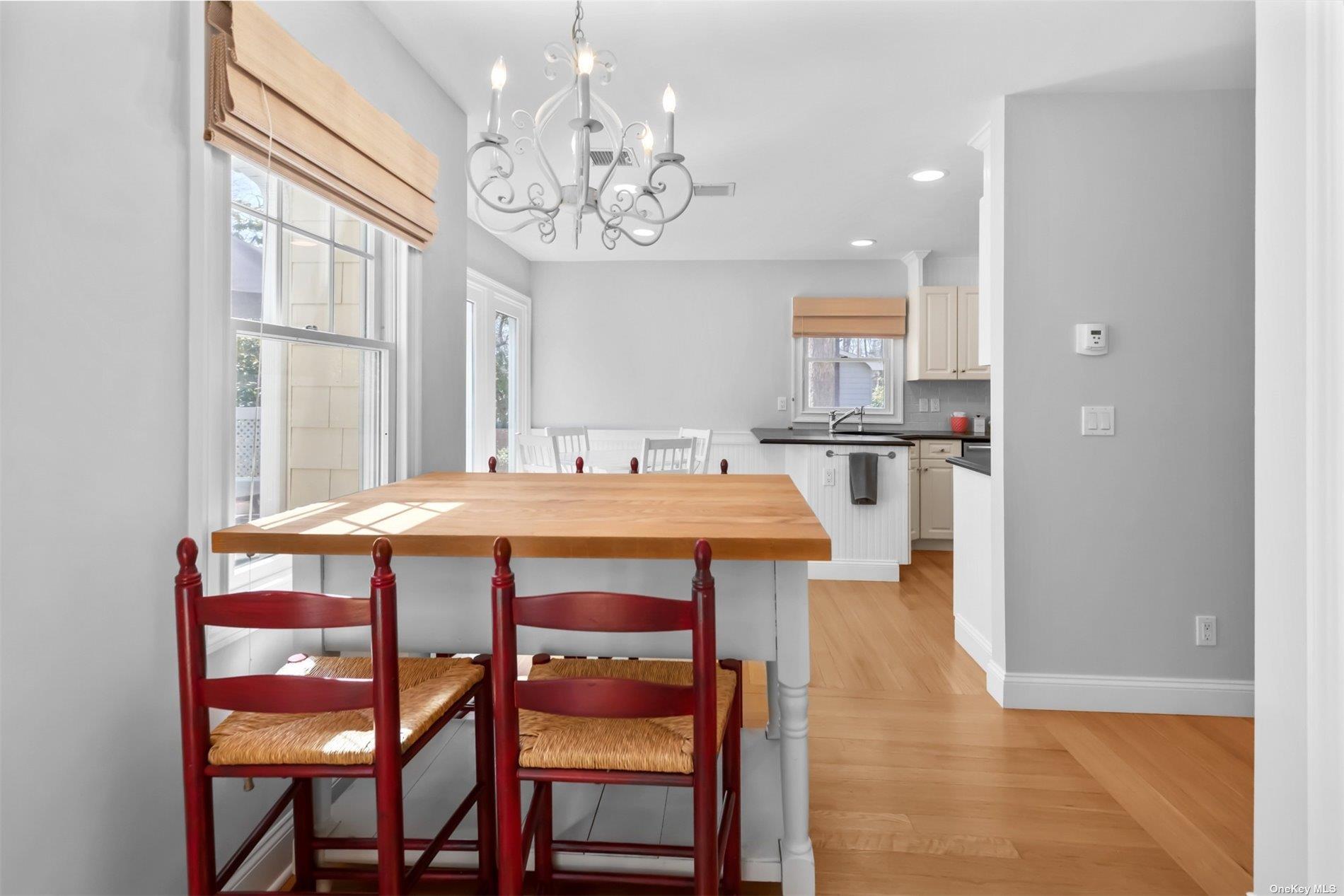 250 Wesland Road Southold, NY 11971 - Photo 14 of 29 a view of a dining room with furniture and chandelier