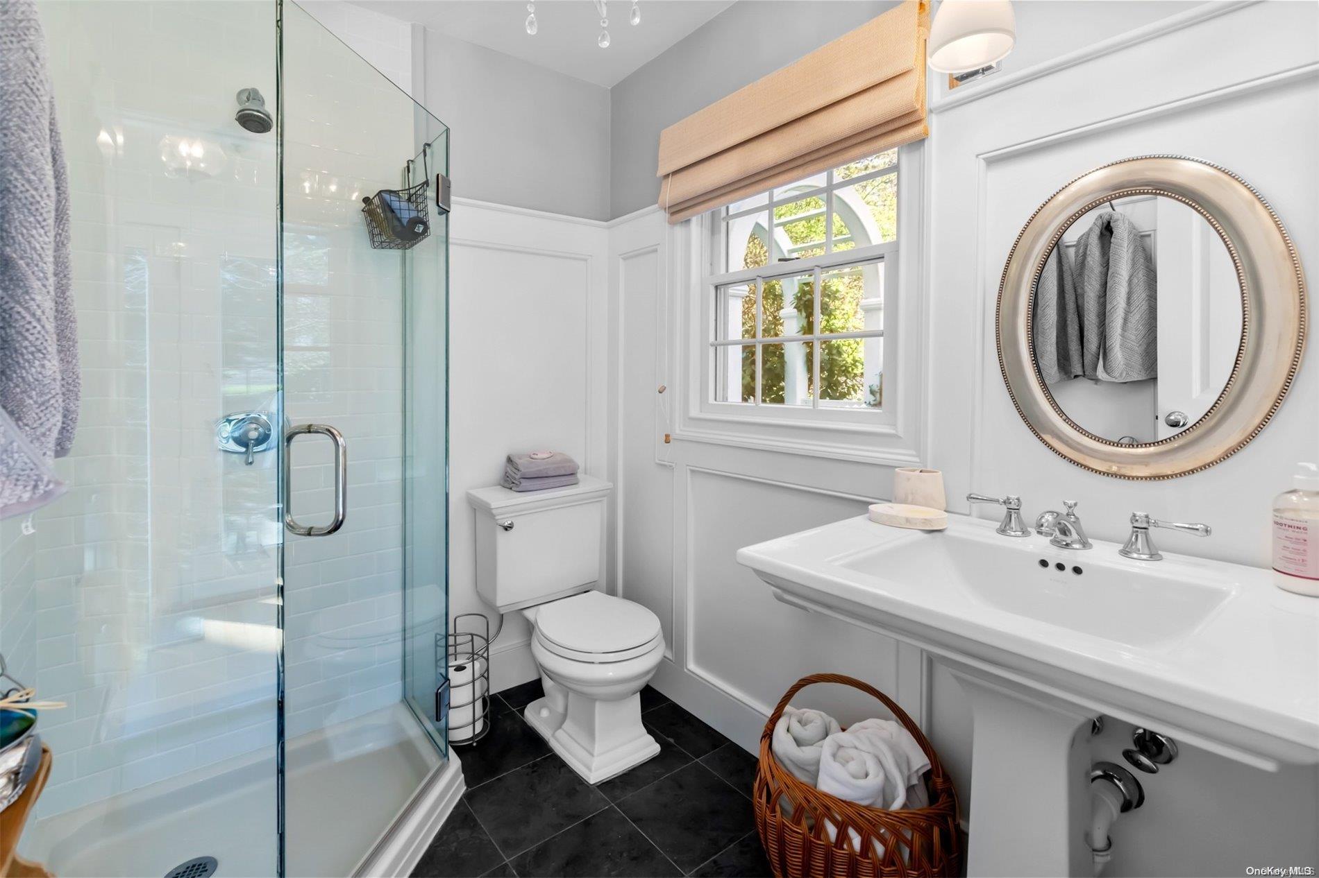 250 Wesland Road Southold, NY 11971 - Photo 18 of 29 a bathroom with a sink toilet and a mirror