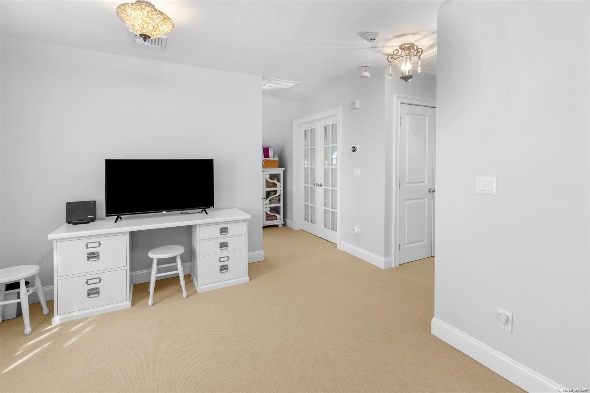 250 Wesland Road Southold, NY 11971 - Photo 21 of 29 a view of a livingroom with furniture and a flat screen tv