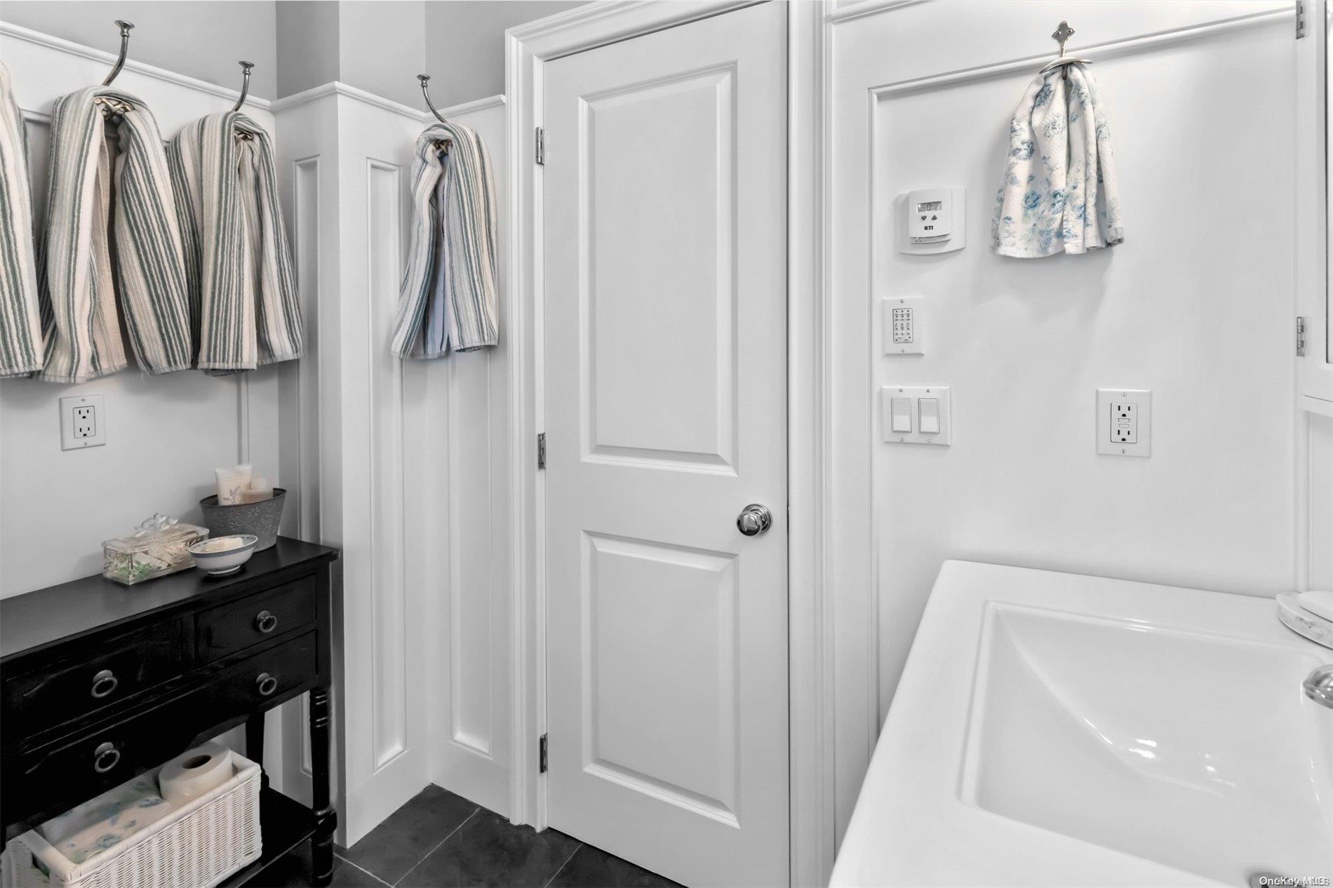 250 Wesland Road Southold, NY 11971 - Photo 25 of 29 a bathroom with a bathtub and a shower