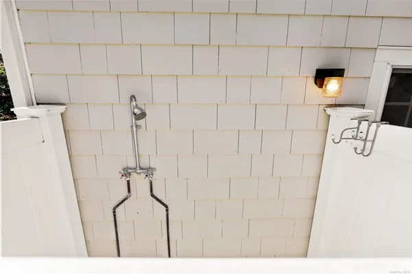 a bathroom with a bathtub and shower
