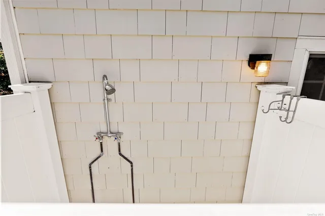 a bathroom with a bathtub and shower