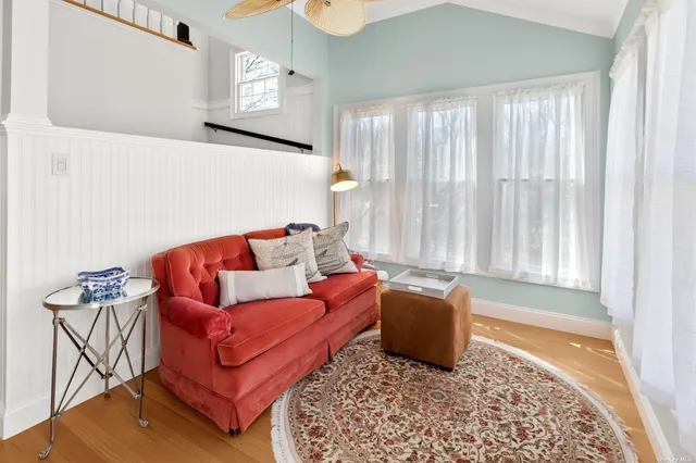 a living room with furniture and a rug
