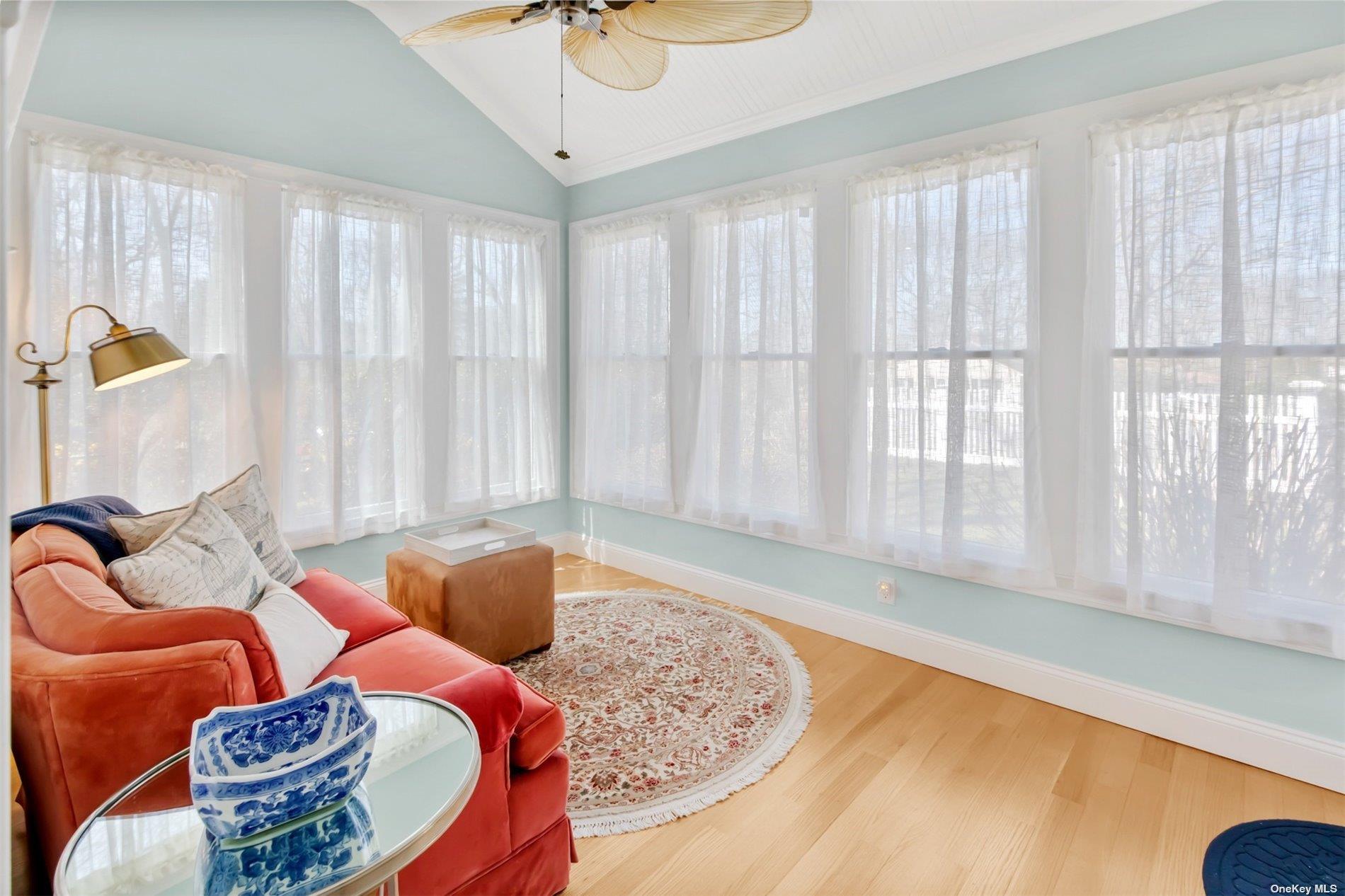 250 Wesland Road Southold, NY 11971 - Photo 9 of 29 a living room with furniture and a large window