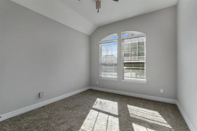 a view of room with window and ceiling fan