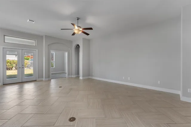 a view of a livingroom with furniture and a kitchen