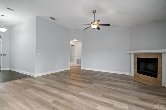 a view of an entryway with wooden floor