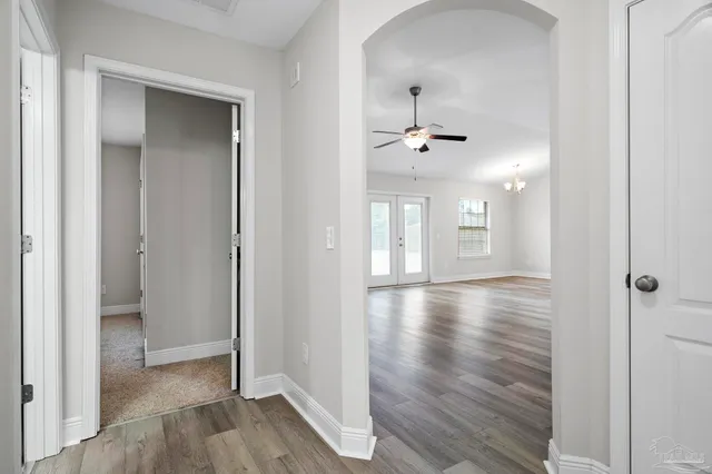 a bathroom with a granite countertop sink toilet a mirror and shower