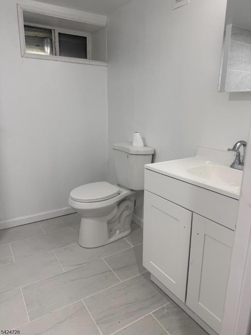 80 Gates Road Somerset, NJ 08873 - Photo 16 of 17 a bathroom with a sink toilet and a vanity
