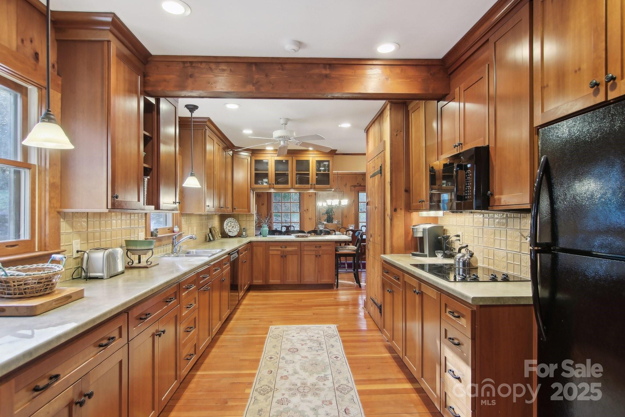 798 Evans Road Hendersonville, NC 28739 - Photo 11 of 45 a kitchen with stainless steel appliances a sink and a refrigerator