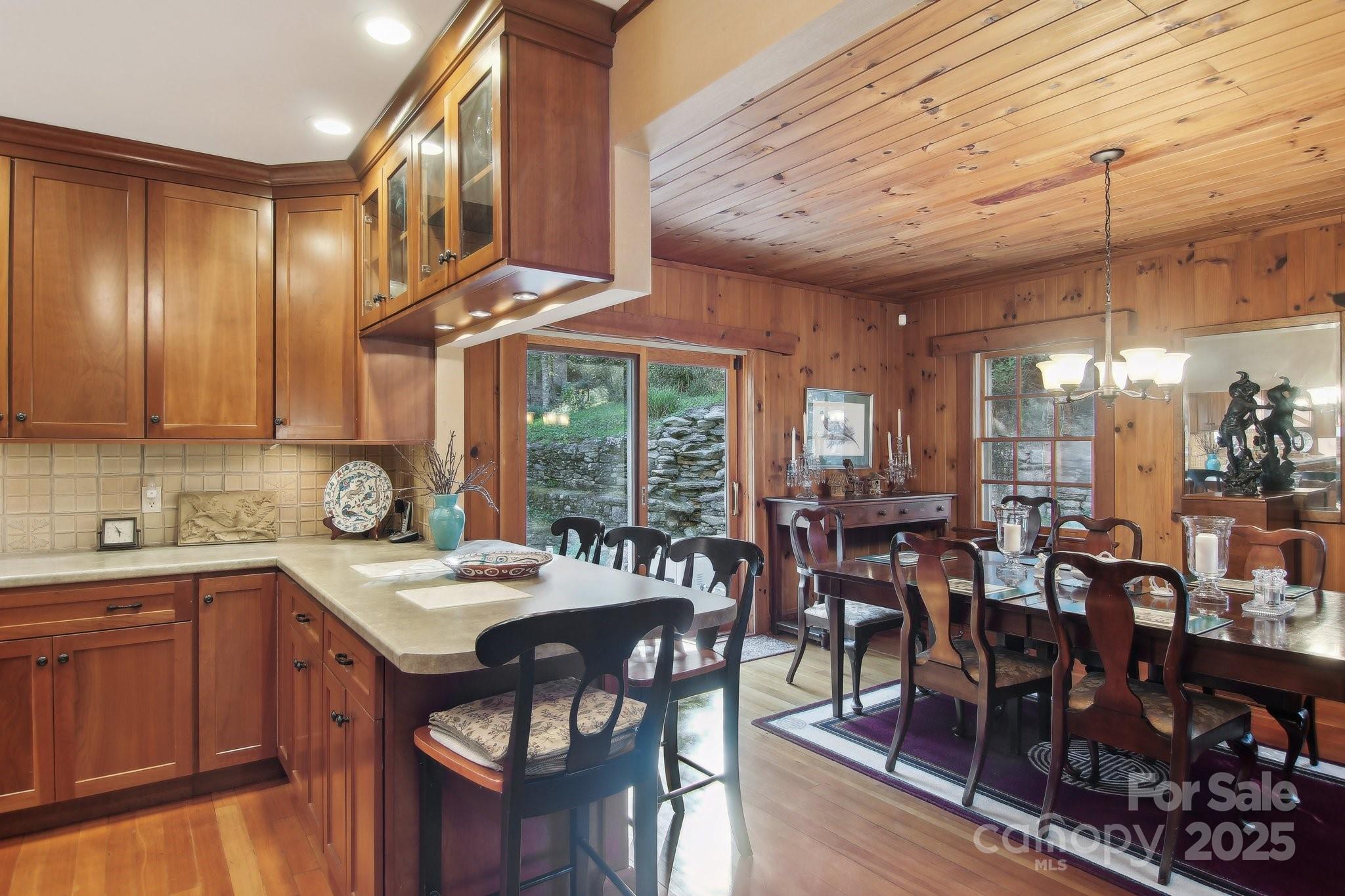 798 Evans Road Hendersonville, NC 28739 - Photo 12 of 45 a kitchen with lots of wooden furniture cabinets and appliances