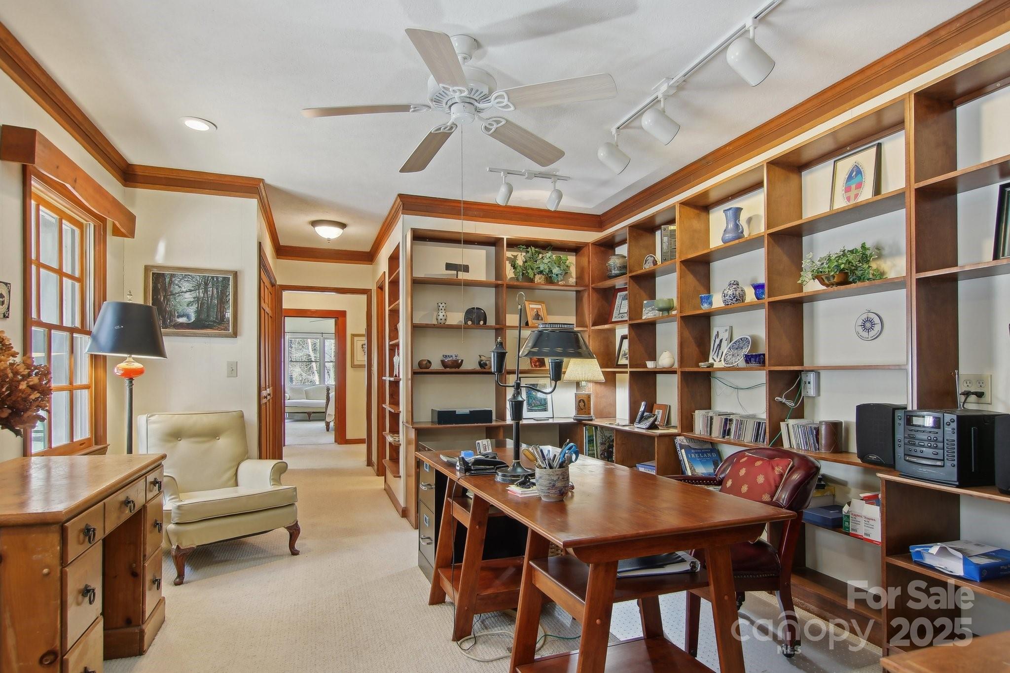 798 Evans Road Hendersonville, NC 28739 - Photo 17 of 45 a living room with furniture a rug and a chandelier