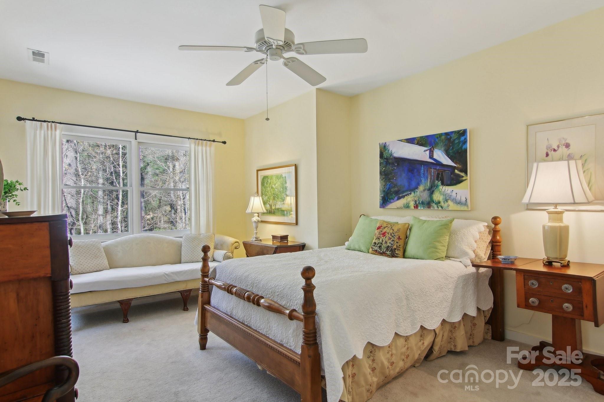 798 Evans Road Hendersonville, NC 28739 - Photo 25 of 45 a bedroom with a bed and a couch