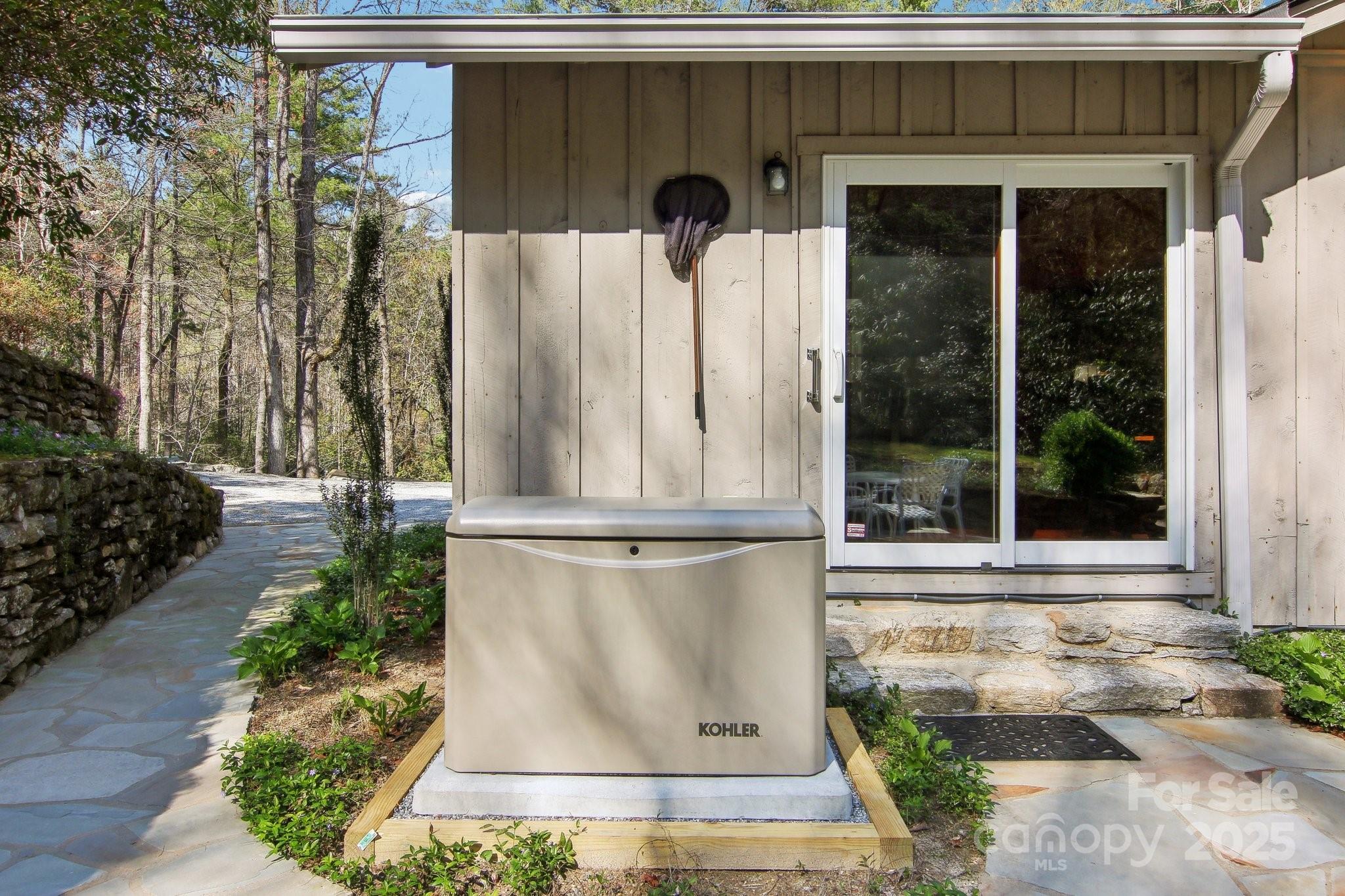 798 Evans Road Hendersonville, NC 28739 - Photo 33 of 45 a view of a back yard with a fountain