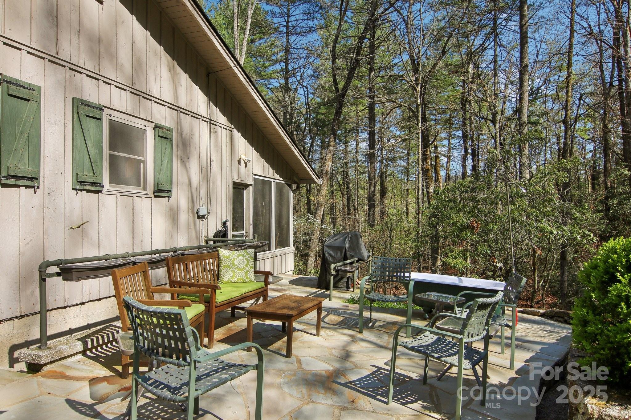 798 Evans Road Hendersonville, NC 28739 - Photo 35 of 45 a view of patio with couple of chairs and couches with wooden floor and fence