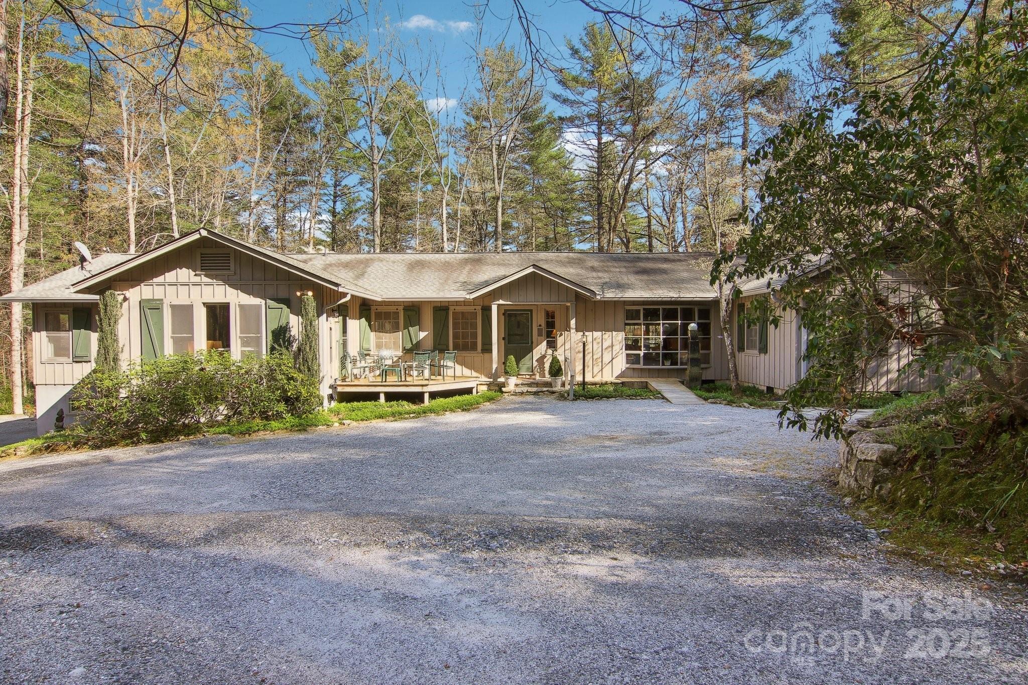 798 Evans Road Hendersonville, NC 28739 - Photo 43 of 45 a view of a house with large outdoor space and a tree
