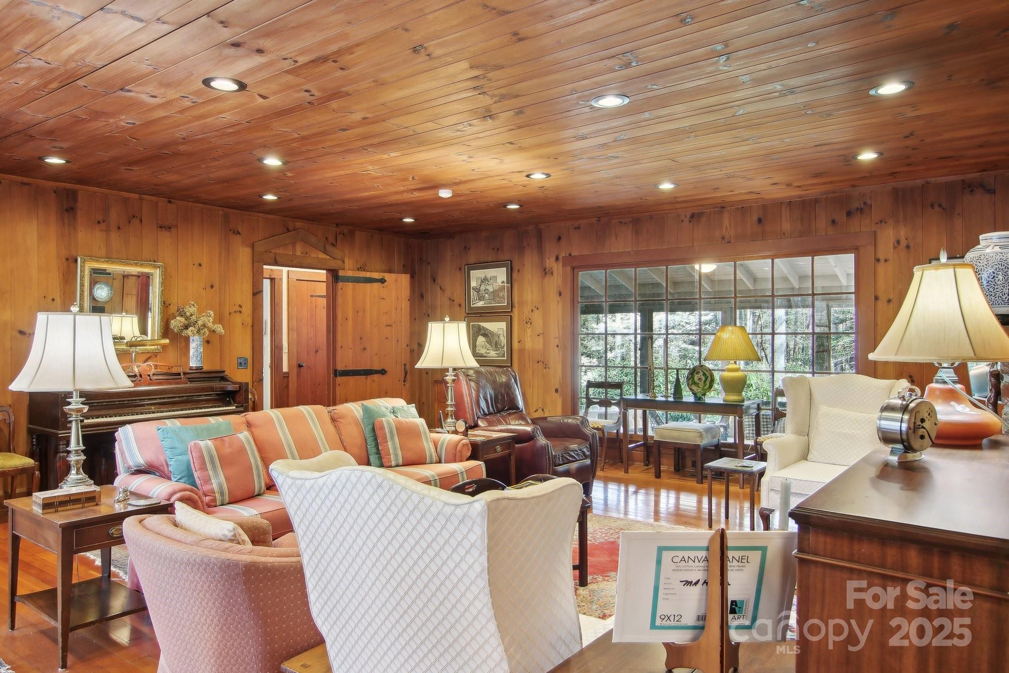 798 Evans Road Hendersonville, NC 28739 - Photo 8 of 45 a living room with furniture a lamp and a table