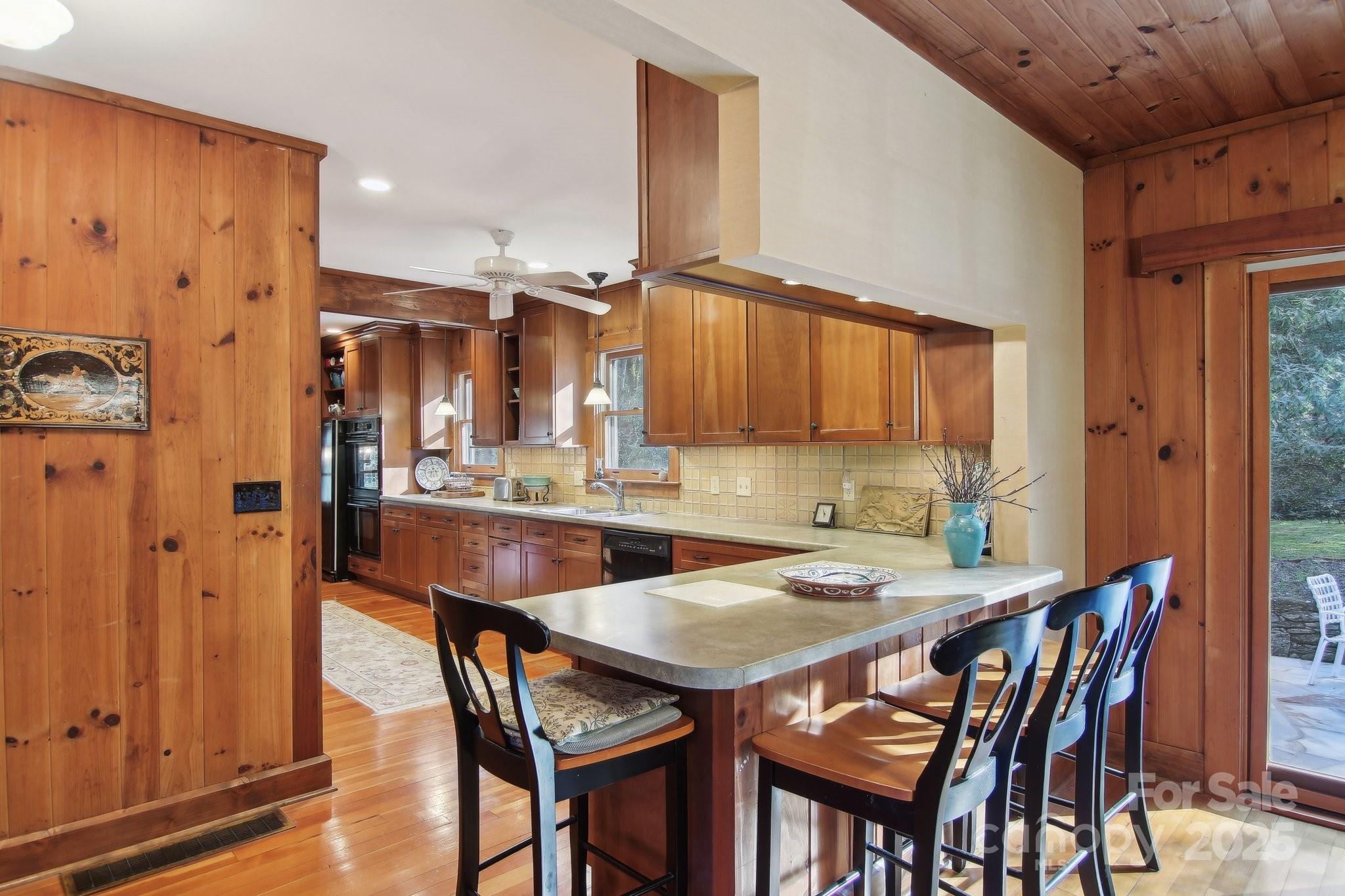 798 Evans Road Hendersonville, NC 28739 - Photo 9 of 45 a view of a dining room with furniture and wooden floor