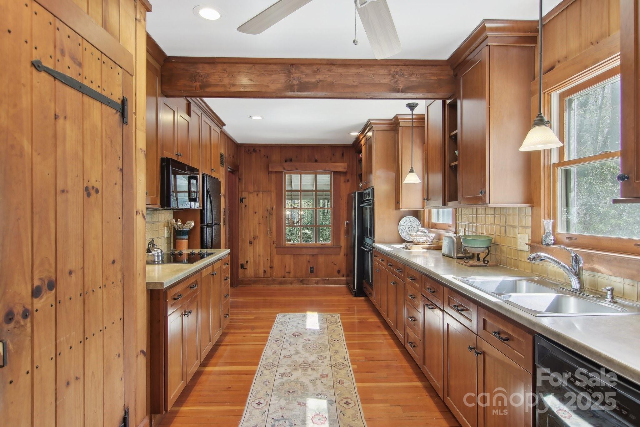 798 Evans Road Hendersonville, NC 28739 - Photo 10 of 45 a large kitchen with a sink and cabinets