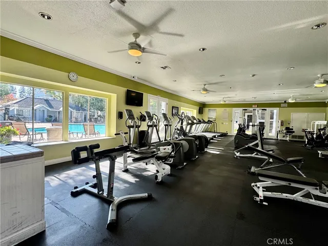 a view of backyard with seating area and trees